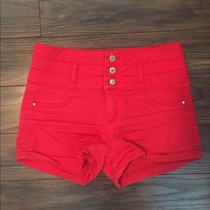 High waisted Red shorts.